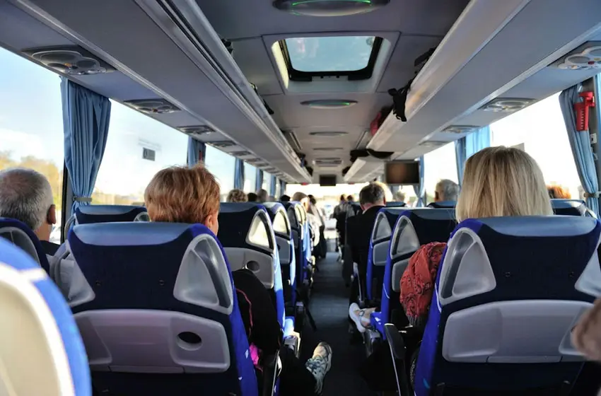 Group travelling inside a luxury bus in Abu Dhabi